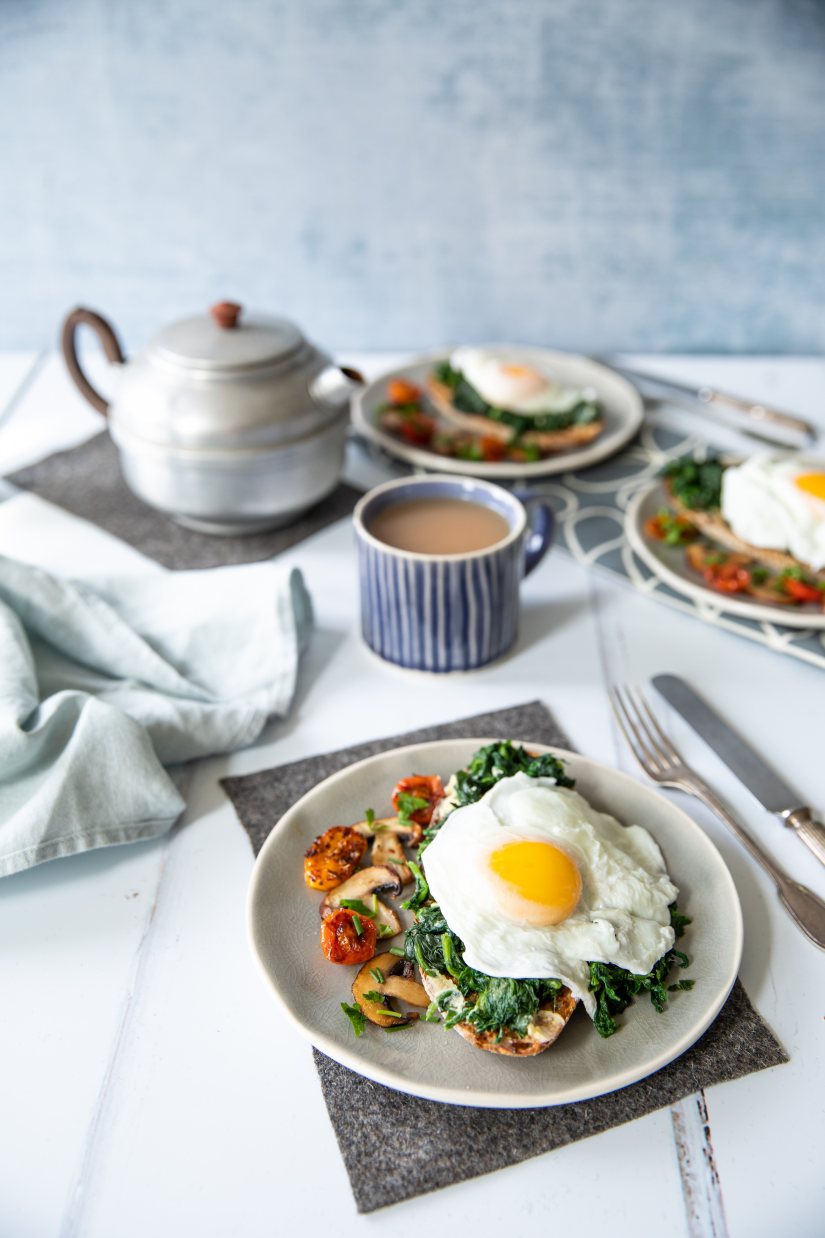 Poached eggs with wilted spinach on rye sourdough toast Recipe: Veggie