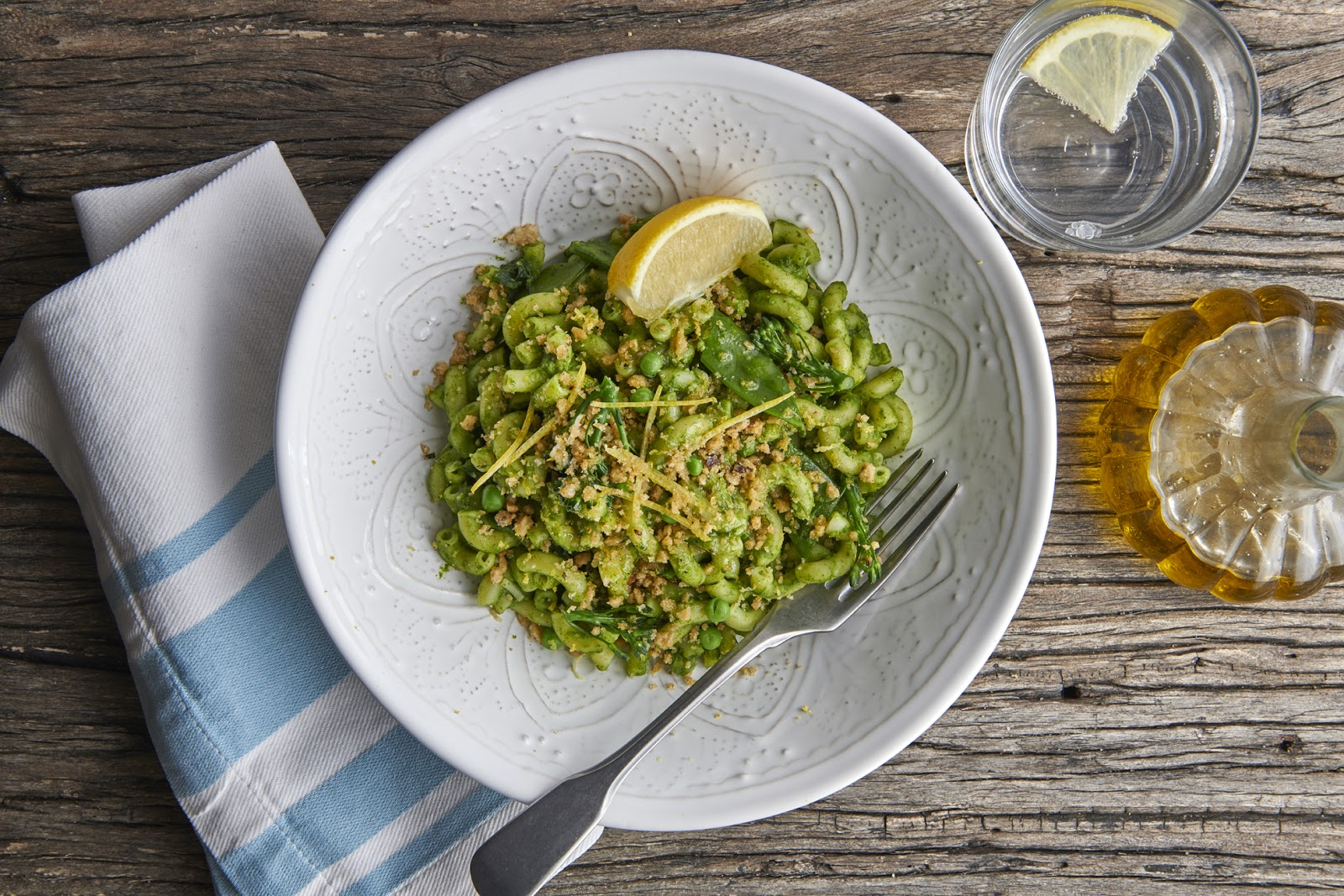 Macaroni with mange tout and broccoli topped with a citrus crumb